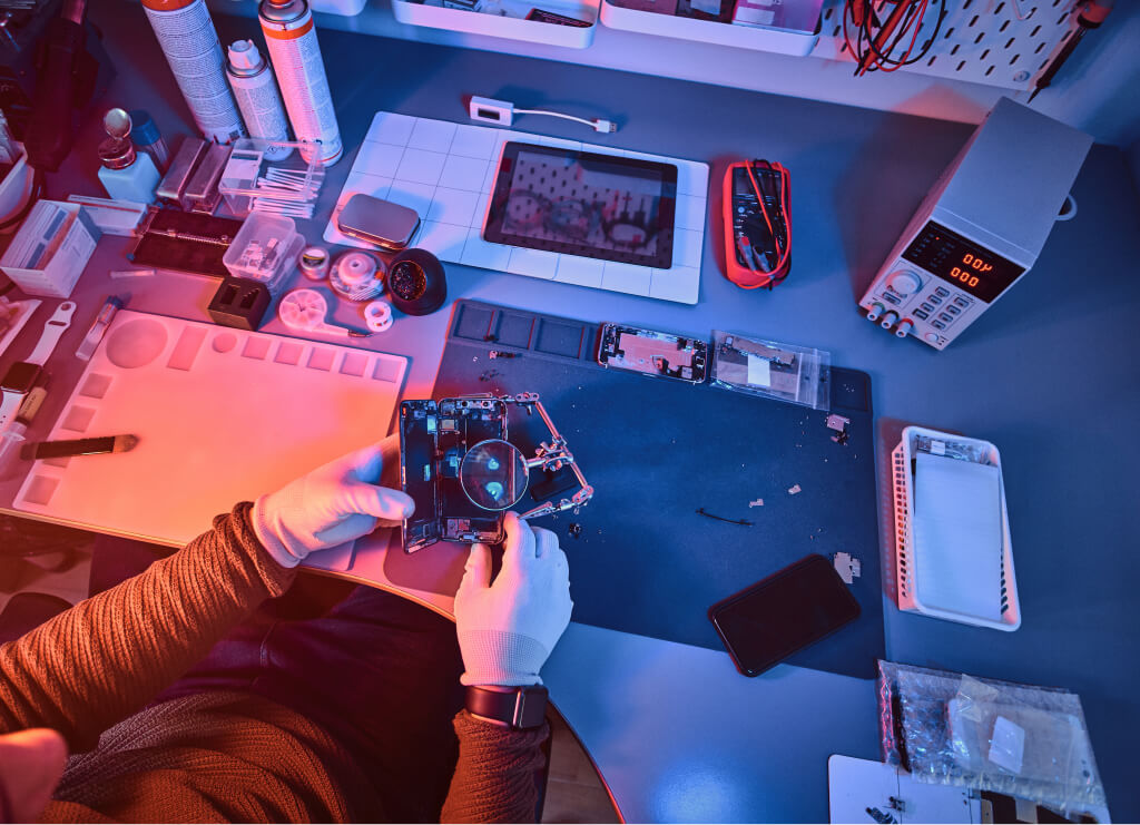 Electronics technician holding a modern smartphone