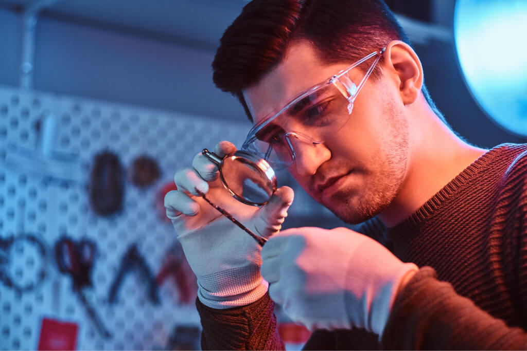 Electronics technician repairing a damaged smartphone